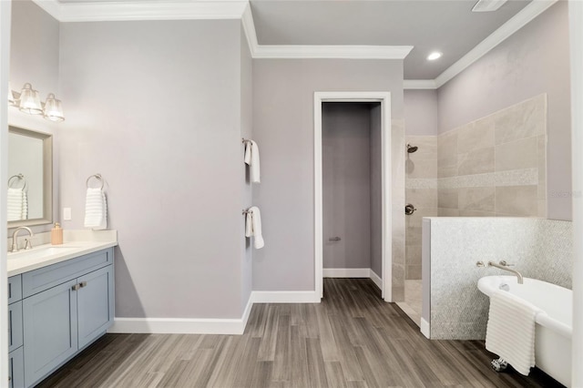 full bathroom with crown molding, vanity, wood finished floors, walk in shower, and baseboards