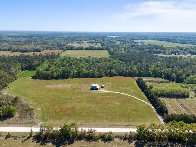 birds eye view of property with a rural view