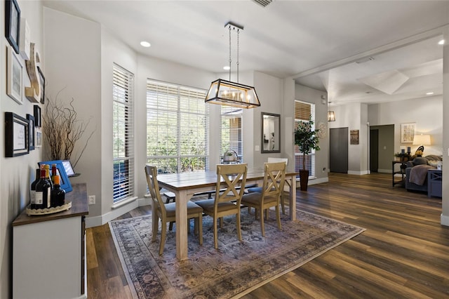 dining room featuring recessed lighting, a notable chandelier, baseboards, and dark wood finished floors