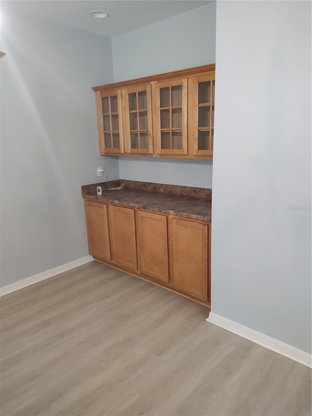 2966 NW 105th Dr, Gainesville, FL 32606 - bar area with light wood-style flooring and baseboards
