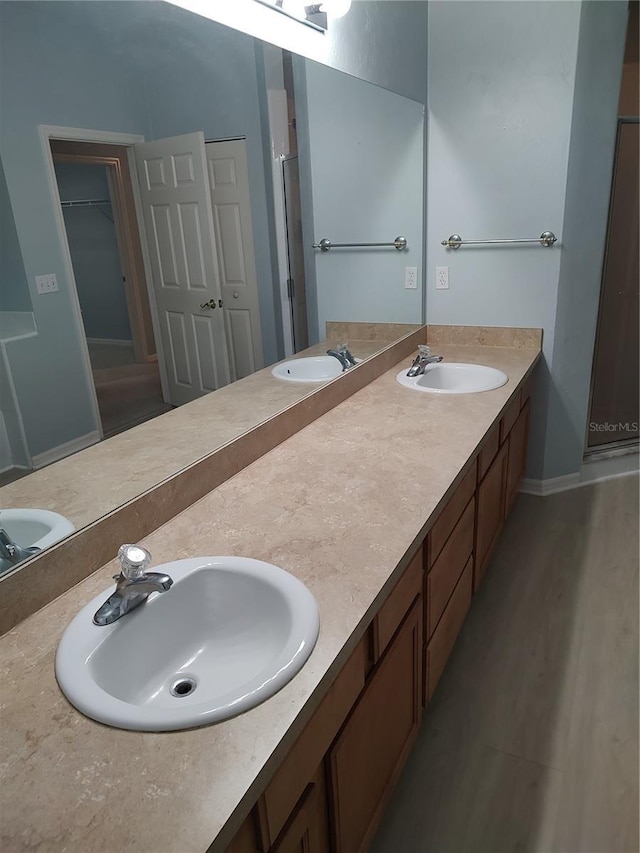 2966 NW 105th Dr, Gainesville, FL 32606 - full bathroom featuring double vanity and baseboards
