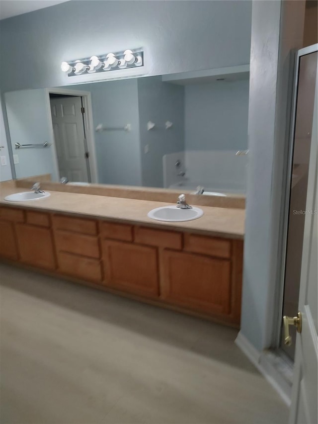 2966 NW 105th Dr, Gainesville, FL 32606 - bathroom with double vanity and a shower with door