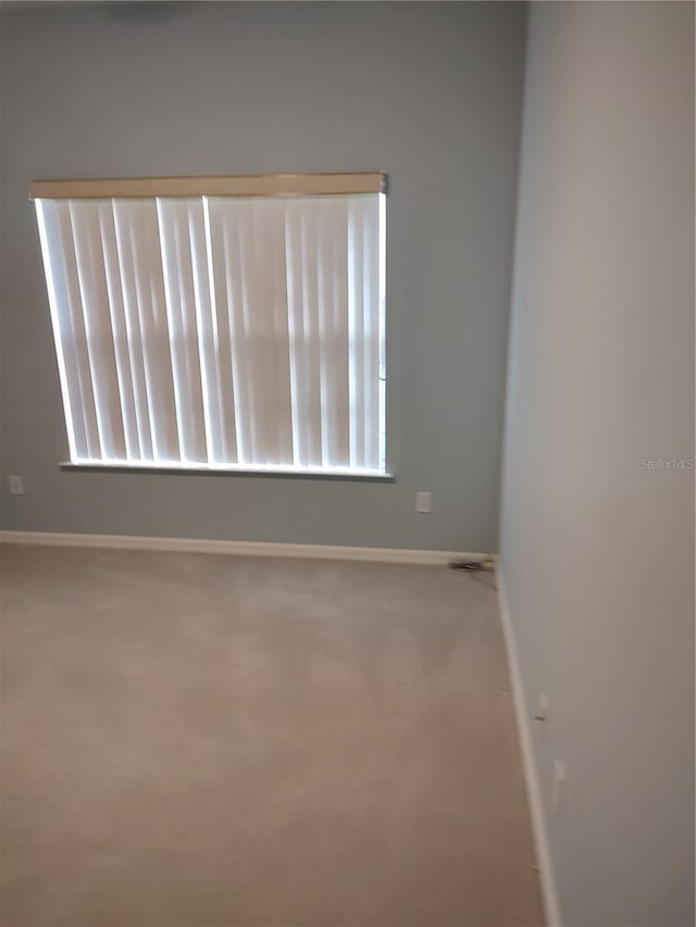 2966 NW 105th Dr, Gainesville, FL 32606 - unfurnished room with baseboards and carpet floors