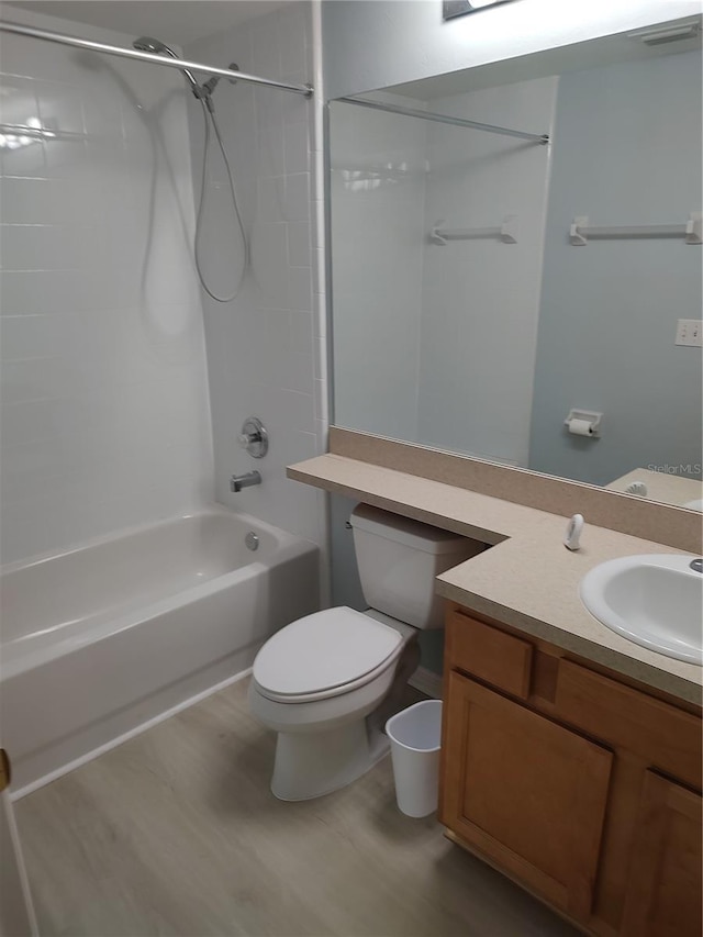 2966 NW 105th Dr, Gainesville, FL 32606 - full bathroom featuring shower / tub combination, vanity, toilet, and wood finished floors