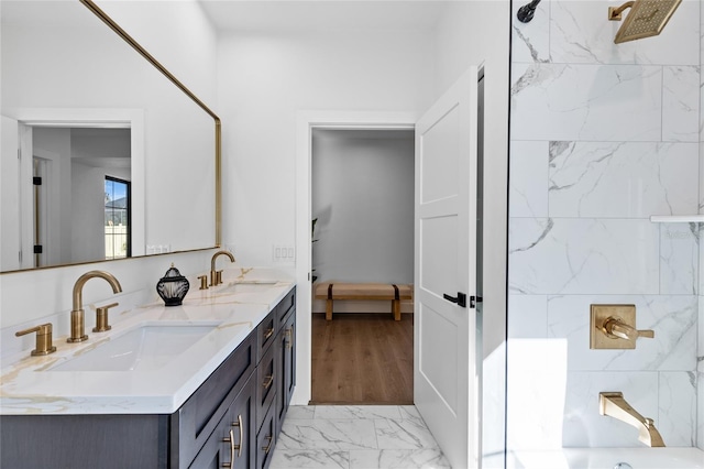 full bathroom featuring double vanity, shower / tub combination, and a sink
