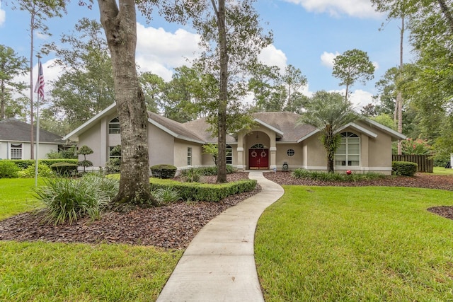 5620 NW 45th Ln, Gainesville, FL 32606 - mid-century inspired home with stucco siding and a front yard