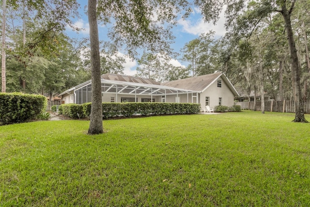 5620 NW 45th Ln, Gainesville, FL 32606 - view of yard featuring glass enclosure and fence