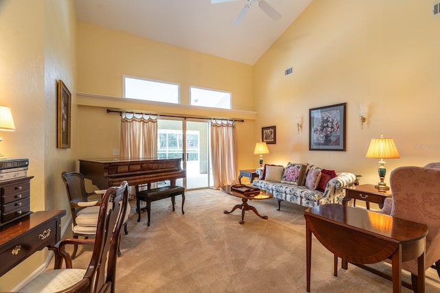 5620 NW 45th Ln, Gainesville, FL 32606 - living area featuring light carpet, visible vents, high vaulted ceiling, and a ceiling fan