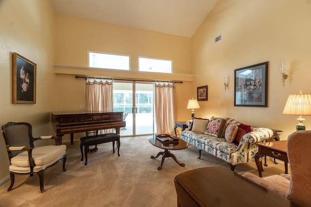 5620 NW 45th Ln, Gainesville, FL 32606 - living room featuring visible vents, high vaulted ceiling, and carpet flooring