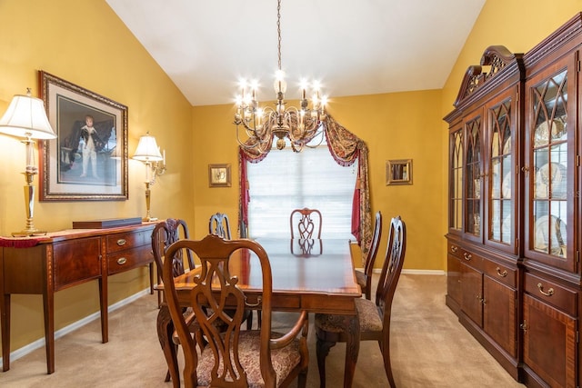 5620 NW 45th Ln, Gainesville, FL 32606 - dining room featuring light carpet, baseboards, lofted ceiling, and an inviting chandelier