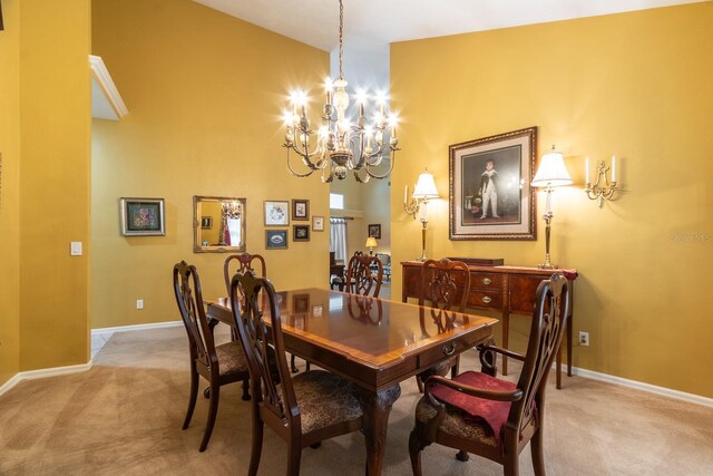 5620 NW 45th Ln, Gainesville, FL 32606 - dining area with light carpet, baseboards, and a notable chandelier