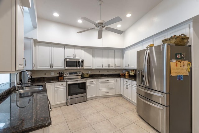 5620 NW 45th Ln, Gainesville, FL 32606 - kitchen with a towering ceiling, a sink, appliances with stainless steel finishes, light tile patterned floors, and ceiling fan