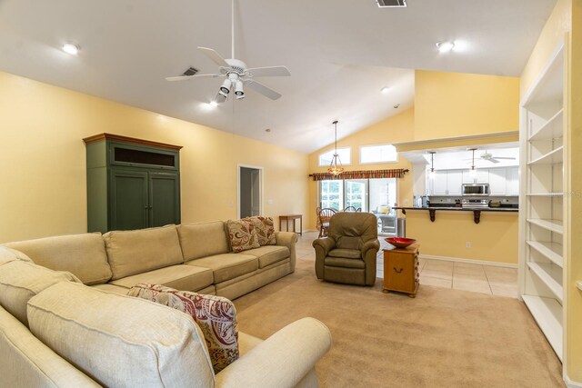 5620 NW 45th Ln, Gainesville, FL 32606 - living area featuring light tile patterned flooring, high vaulted ceiling, visible vents, light carpet, and ceiling fan with notable chandelier
