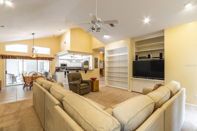 5620 NW 45th Ln, Gainesville, FL 32606 - living room featuring light colored carpet, light tile patterned floors, ceiling fan with notable chandelier, and built in shelves