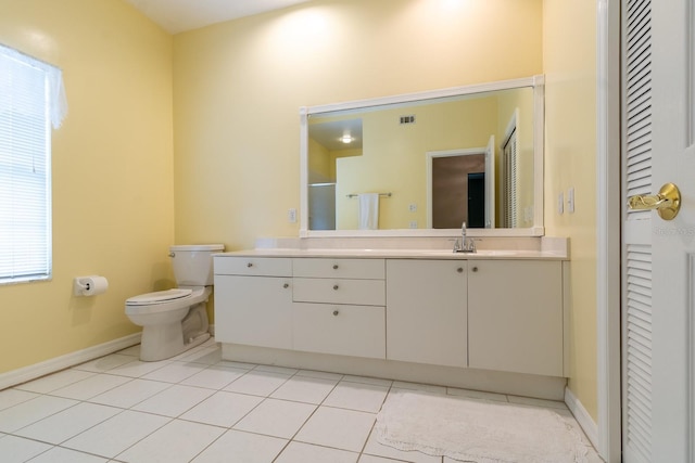 5620 NW 45th Ln, Gainesville, FL 32606 - bathroom with tile patterned flooring, vanity, toilet, baseboards, and visible vents