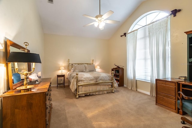 5620 NW 45th Ln, Gainesville, FL 32606 - bedroom featuring visible vents, baseboards, a ceiling fan, lofted ceiling, and light colored carpet