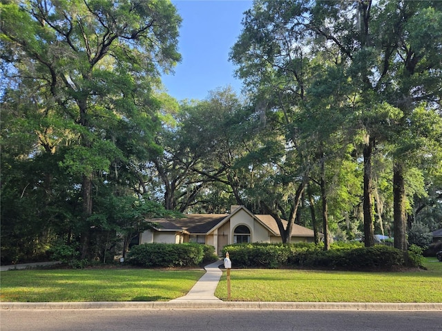 7717 SW 22nd Ave, Gainesville, FL 32607 - view of front of property featuring a front lawn and stucco siding