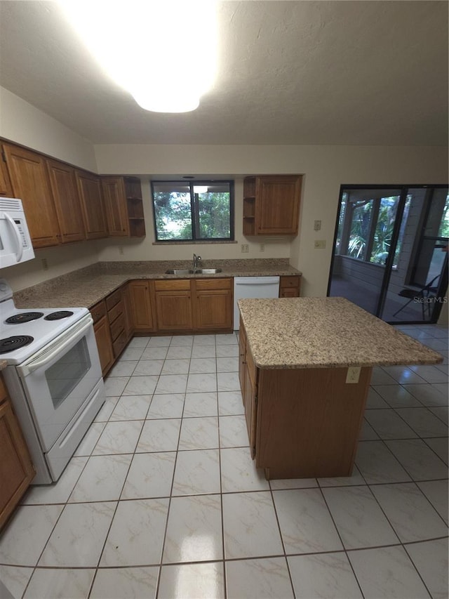 7717 SW 22nd Ave, Gainesville, FL 32607 - kitchen featuring open shelves, white appliances, a sink, brown cabinetry, and healthy amount of natural light