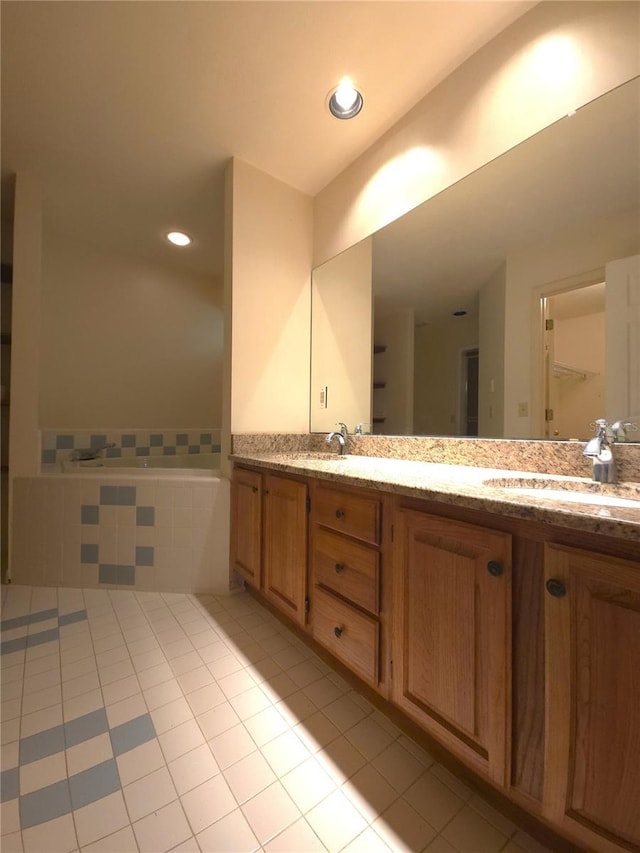 7717 SW 22nd Ave, Gainesville, FL 32607 - full bathroom featuring tile patterned floors, double vanity, and recessed lighting
