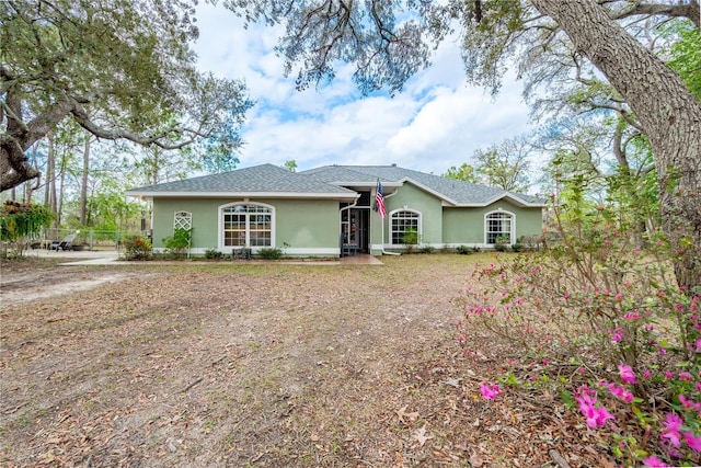 6550 SE 123rd Ter, Morriston, FL 32668 - ranch-style home featuring stucco siding and a shingled roof