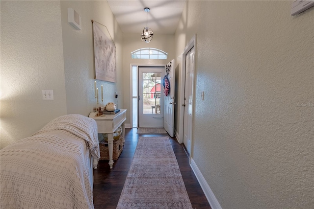 6550 SE 123rd Ter, Morriston, FL 32668 - doorway to outside with dark wood finished floors, baseboards, and a textured wall