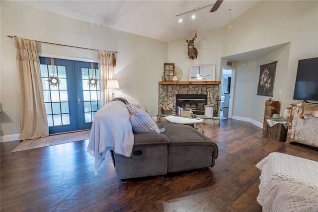 6550 SE 123rd Ter, Morriston, FL 32668 - living room featuring french doors, a ceiling fan, a fireplace, wood finished floors, and baseboards