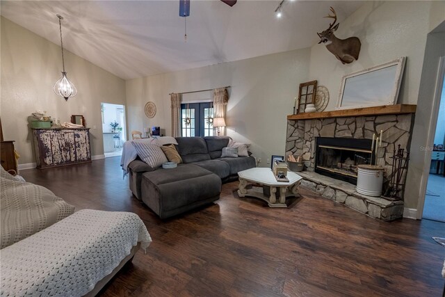 6550 SE 123rd Ter, Morriston, FL 32668 - living room featuring a ceiling fan, a fireplace, wood finished floors, lofted ceiling, and baseboards
