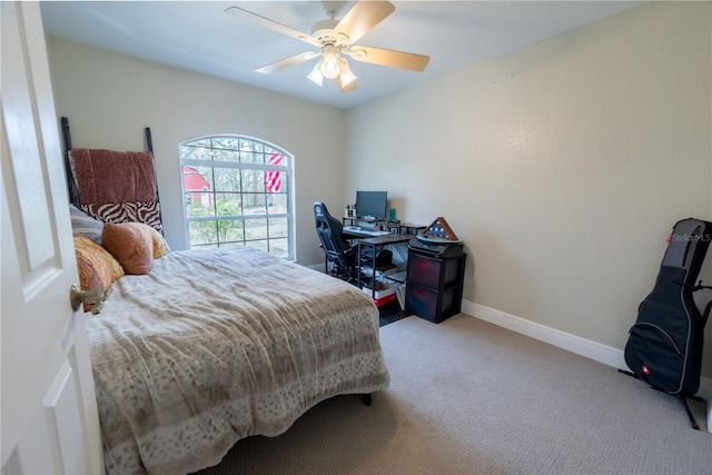 6550 SE 123rd Ter, Morriston, FL 32668 - bedroom featuring baseboards, carpet flooring, and a ceiling fan