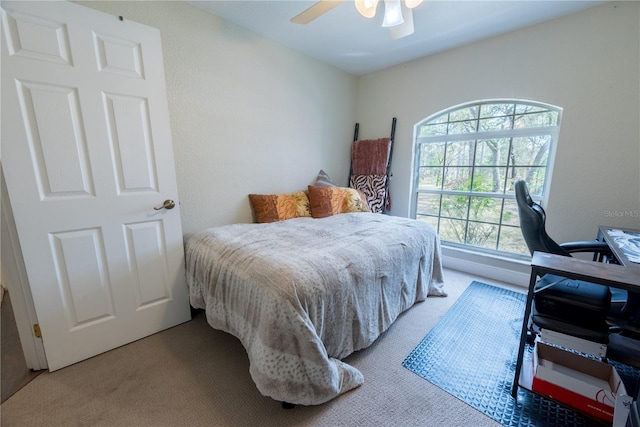 6550 SE 123rd Ter, Morriston, FL 32668 - carpeted bedroom featuring a ceiling fan