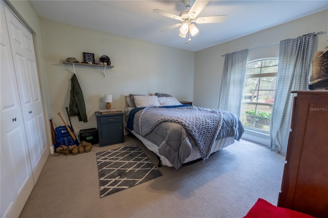 6550 SE 123rd Ter, Morriston, FL 32668 - bedroom featuring carpet flooring, a ceiling fan, and a closet
