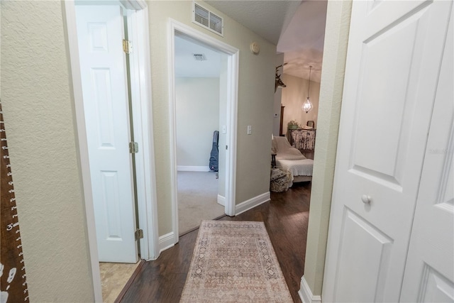 6550 SE 123rd Ter, Morriston, FL 32668 - hall with dark wood finished floors, baseboards, and visible vents