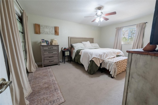 6550 SE 123rd Ter, Morriston, FL 32668 - bedroom featuring light carpet and ceiling fan