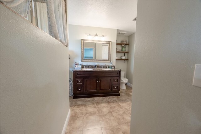 6550 SE 123rd Ter, Morriston, FL 32668 - bathroom featuring baseboards, visible vents, toilet, and vanity