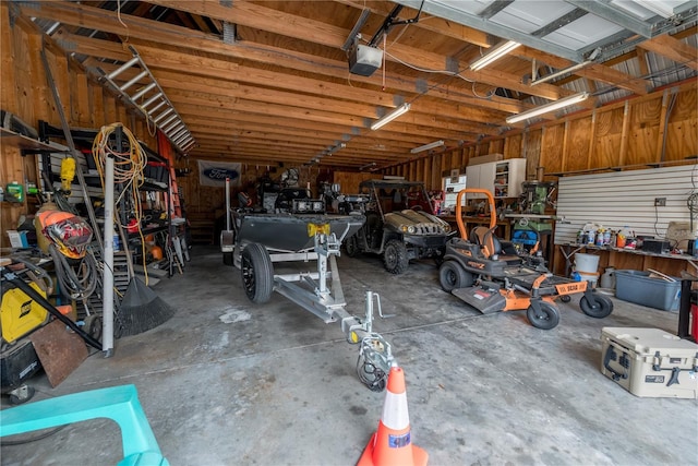 6550 SE 123rd Ter, Morriston, FL 32668 - garage featuring a workshop area and a garage door opener