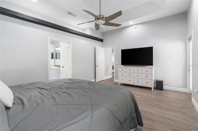 bedroom featuring a ceiling fan, visible vents, recessed lighting, wood finished floors, and baseboards