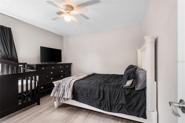 bedroom featuring a ceiling fan and wood finished floors