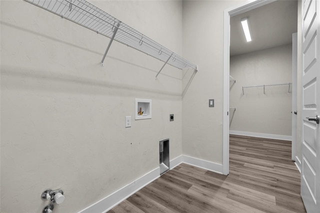 washroom featuring wood finished floors, baseboards, laundry area, and washer hookup