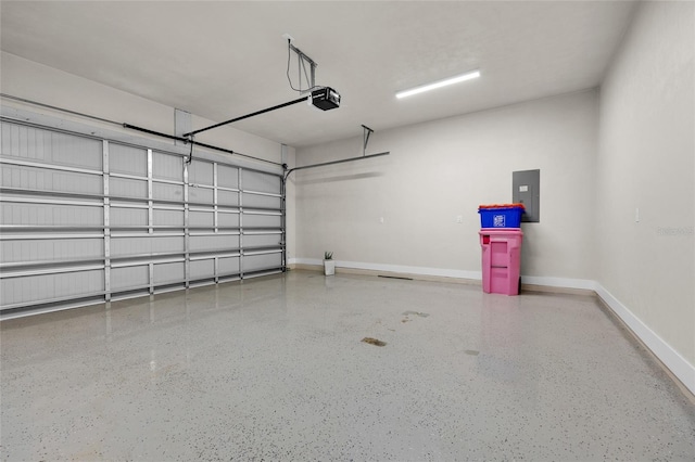 garage with baseboards, a garage door opener, and electric panel