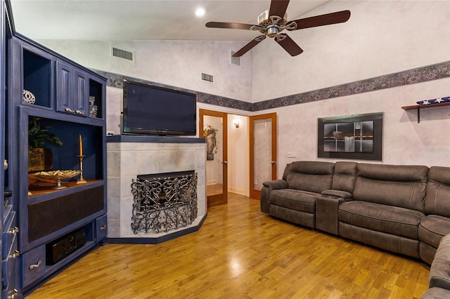 11112 Palmetto Blvd, Alachua, FL 32615 - living room with visible vents, light wood-style flooring, ceiling fan, and a fireplace