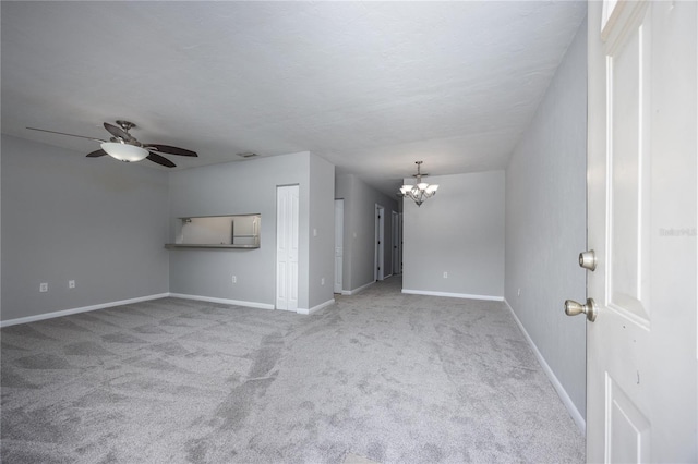 501 SW 75th St Unit E3, Gainesville, FL 32607 - carpeted empty room with a chandelier, ceiling fan, and baseboards
