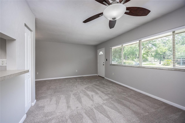 501 SW 75th St Unit E3, Gainesville, FL 32607 - unfurnished room featuring a ceiling fan, carpet floors, and baseboards