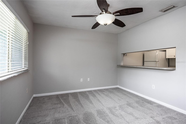 501 SW 75th St Unit E3, Gainesville, FL 32607 - carpeted spare room featuring ceiling fan and baseboards