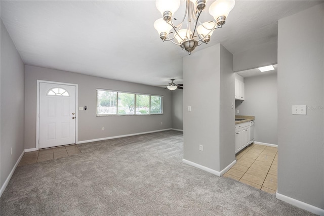501 SW 75th St Unit E3, Gainesville, FL 32607 - entrance foyer with light colored carpet, light tile patterned floors, a chandelier, ceiling fan, and baseboards