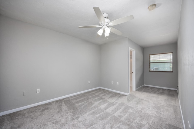 501 SW 75th St Unit E3, Gainesville, FL 32607 - unfurnished room featuring a smoke detector, carpet, baseboards, and a ceiling fan