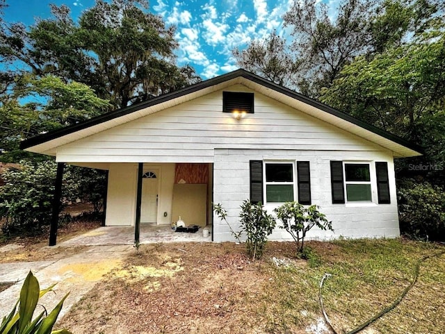 bungalow featuring a carport