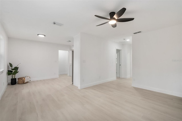 4120 NW 10th St, Gainesville, FL 32609 - unfurnished room featuring light wood finished floors, ceiling fan, and baseboards