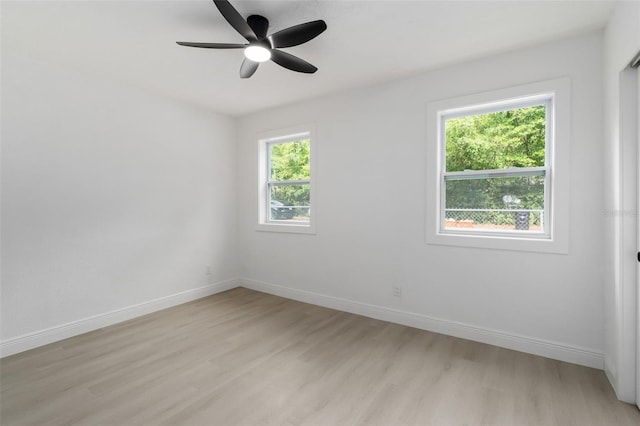 4120 NW 10th St, Gainesville, FL 32609 - empty room featuring light wood-type flooring, baseboards, and ceiling fan