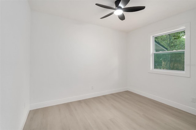 4120 NW 10th St, Gainesville, FL 32609 - empty room featuring light wood-style flooring, baseboards, and a ceiling fan