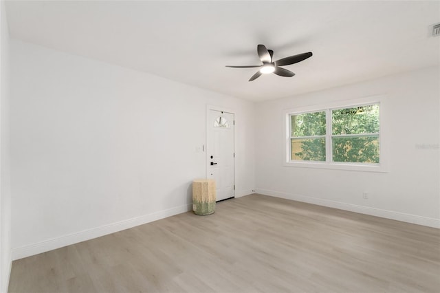 4120 NW 10th St, Gainesville, FL 32609 - empty room with a ceiling fan, light wood-type flooring, and baseboards