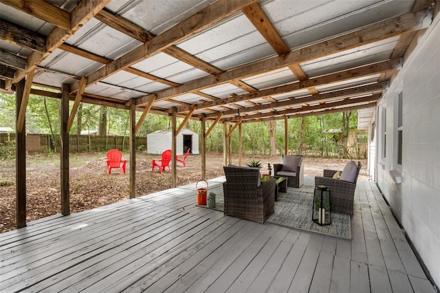 4120 NW 10th St, Gainesville, FL 32609 - wooden deck with an outdoor hangout area and a fenced backyard